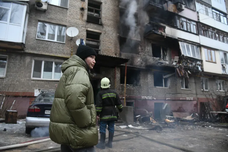 
Firefighters are actively engaged in addressing the aftermath of shelling at an apartment block in the Russian-occupied region of Donetsk in Ukraine. The incident has led to a response from emergency services, with the focus on managing the consequences of the attack. The image underscores the challenges faced by civilians and emergency personnel in conflict zones, highlighting the impact of ongoing hostilities on residential areas.